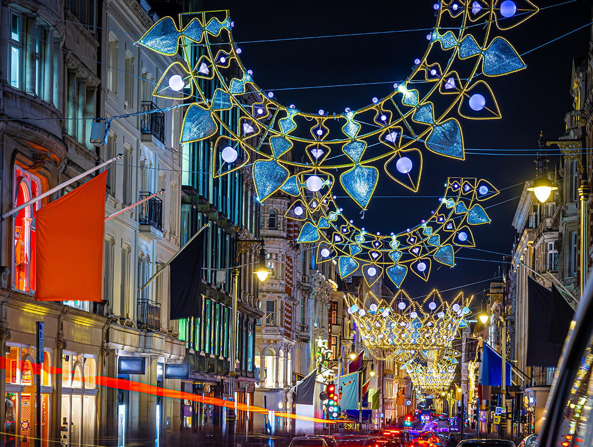 Luxury shopping street lined with flags and boutiques