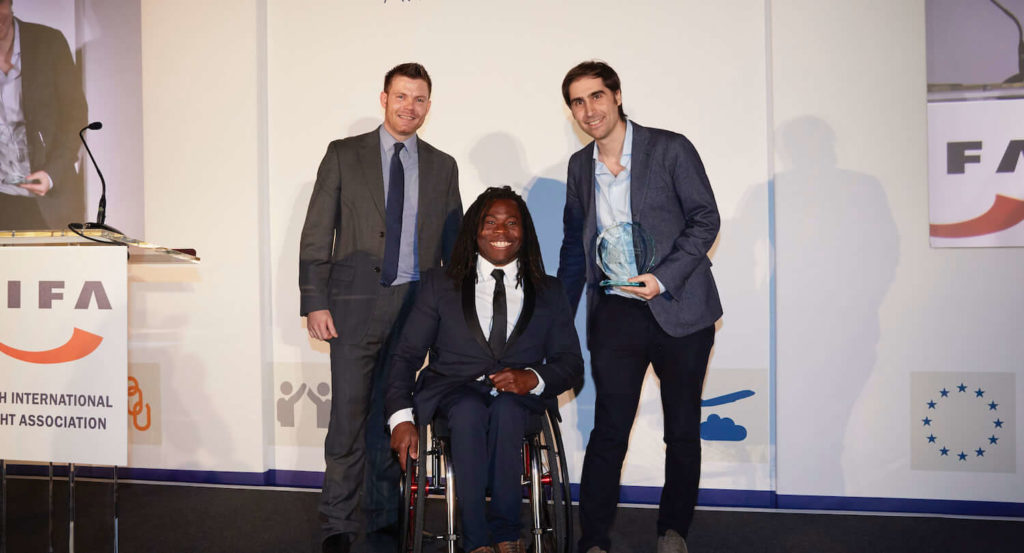 Zencargo Co-Founder Richard Fattal accepting the BIFA Supply Chain Management Award from Paralympian Ade Adepitan MBE and Shane Paddington of BoxTop Technologies